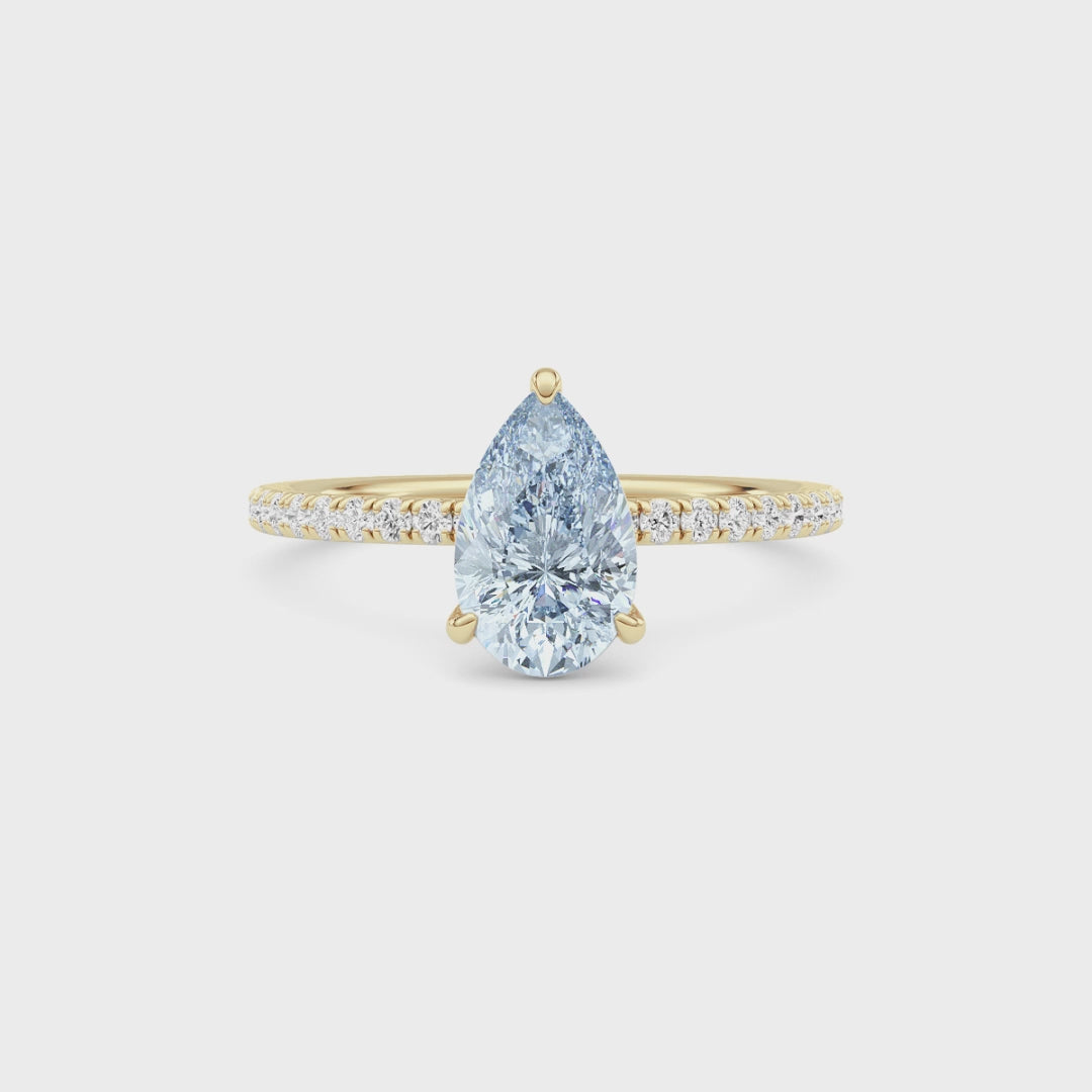 Yellow gold Fancy Blue Pear Cut Diamond Solitaire with Pavé Band