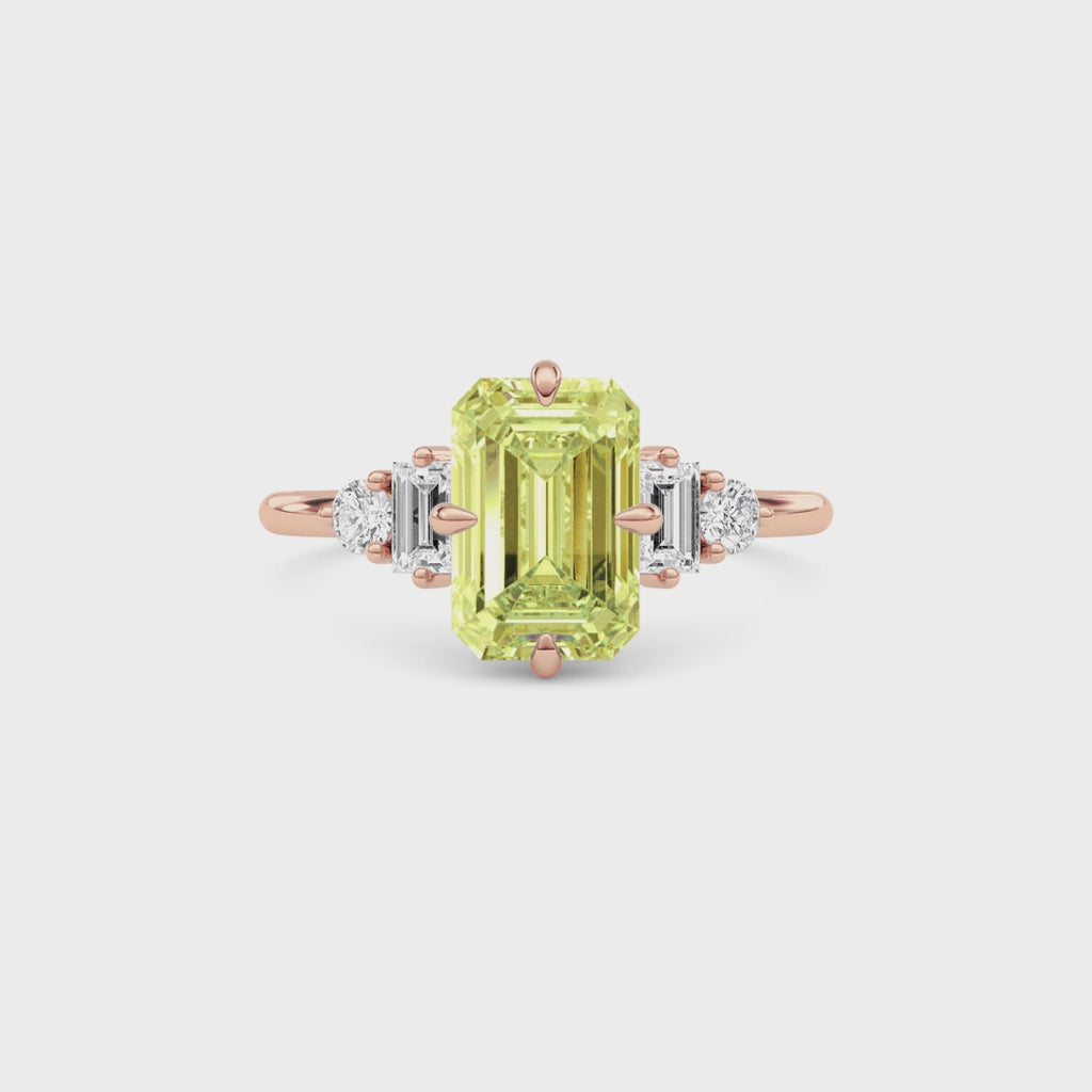 Rose gold Three-Stone Fancy Yellow Emerald Cut Diamond Ring with Heart Side Stones