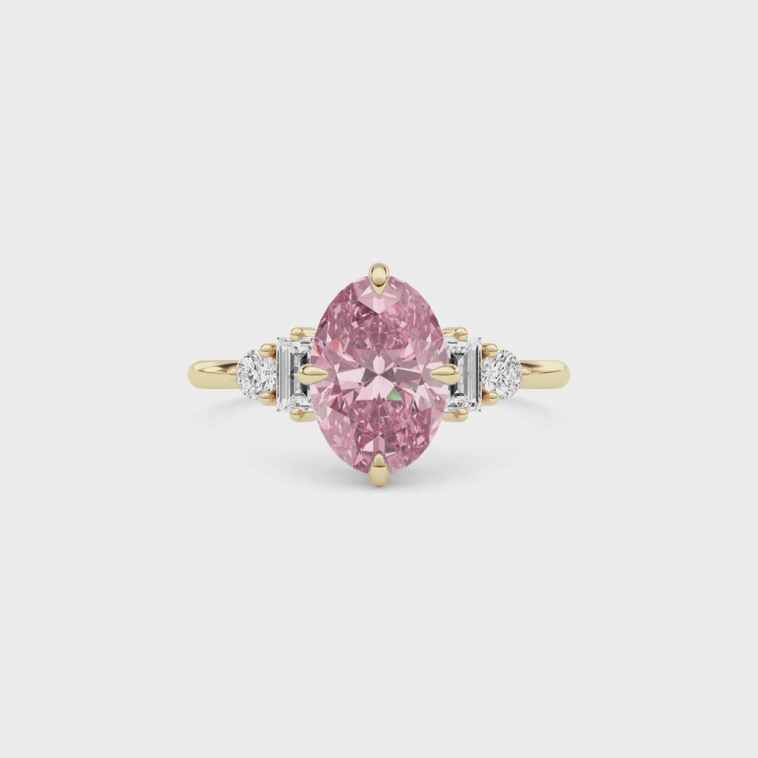 Yellow gold Fancy Pink Oval Cut Three Stone Diamond Engagement Ring with Tapered Baguette and Round Side Stones