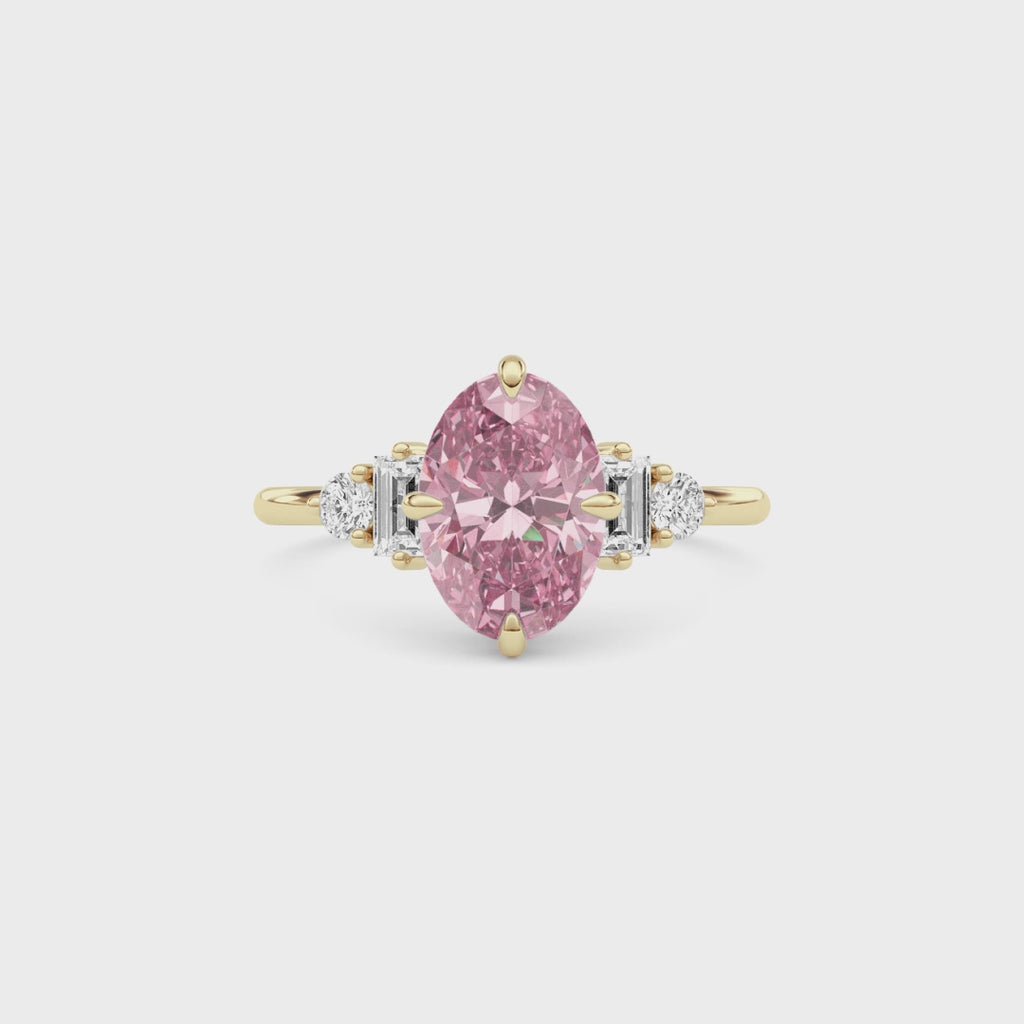 Yellow gold Fancy Pink Oval Cut Three Stone Diamond Engagement Ring with Tapered Baguette and Round Side Stones