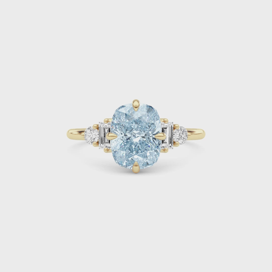 Yellow gold Fancy Blue Cushion Cut Three Stone Diamond Engagement Ring with Tapered Baguette and Round Side Stones