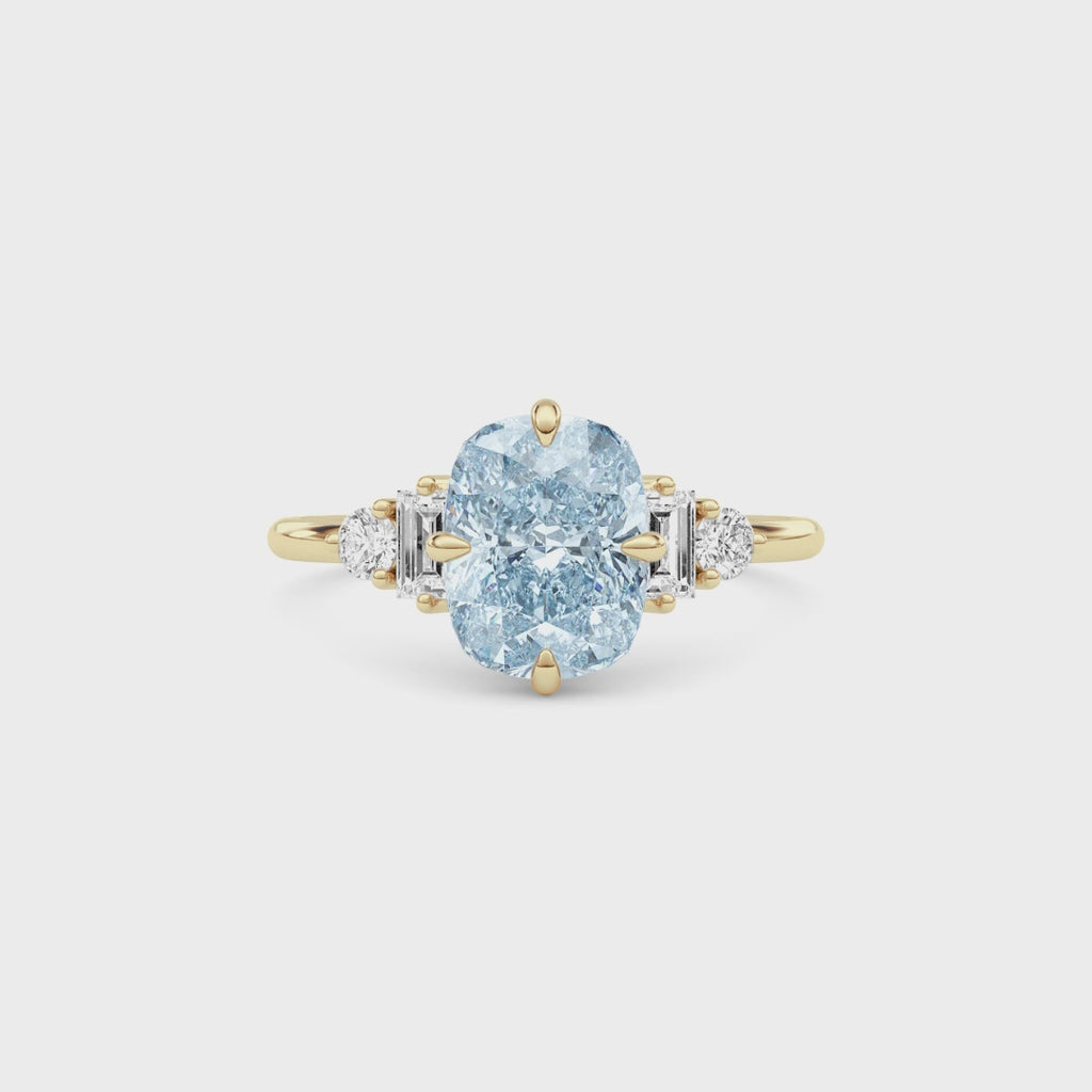 Yellow gold Fancy Blue Cushion Cut Three Stone Diamond Engagement Ring with Tapered Baguette and Round Side Stones