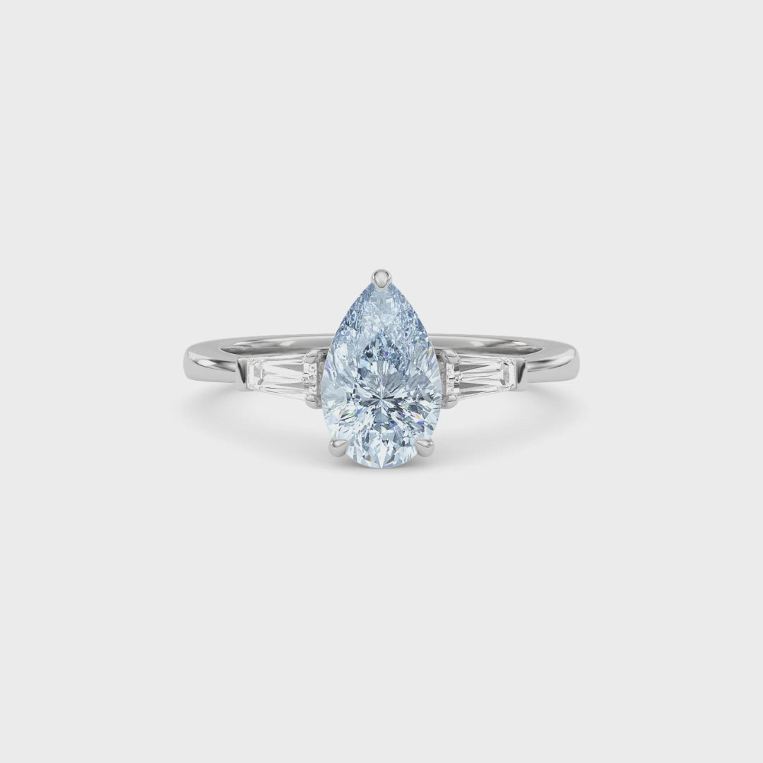 White gold Three-Stone Fancy Blue Pear Cut Diamond Ring with Tapered Baguette Side Stones