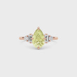 Rose gold Fancy Yellow Pear Cut Three Stone Diamond Engagement Ring with Tapered Baguette and Round Side Stones