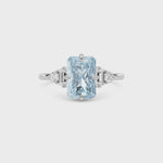 White gold Three-Stone Fancy Blue Radiant Cut Diamond Ring with Heart Side Stones