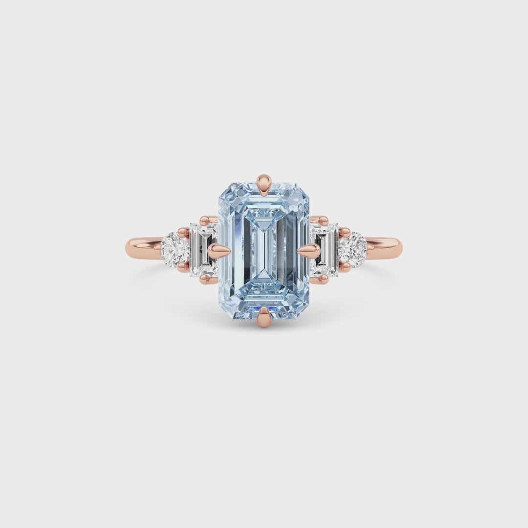 Rose gold Three-Stone Fancy Blue Emerald Cut Diamond Ring with Heart Side Stones