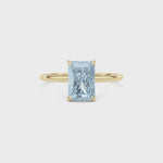Yellow gold Fancy Blue Radiant Cut Diamond Hidden Halo Solitaire Engagement Ring with Prong Setting