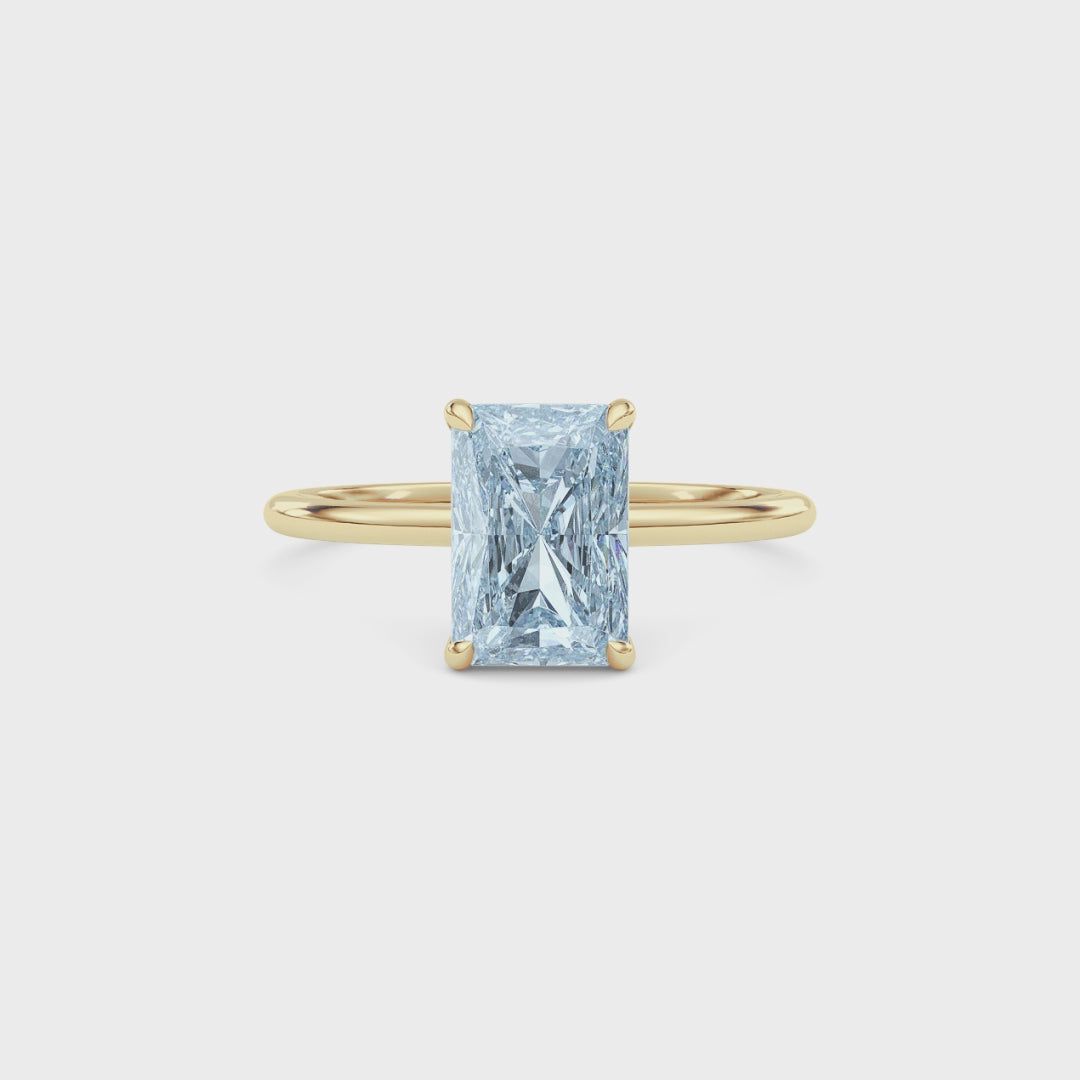 Yellow gold Fancy Blue Radiant Cut Diamond Hidden Halo Solitaire Engagement Ring with Prong Setting
