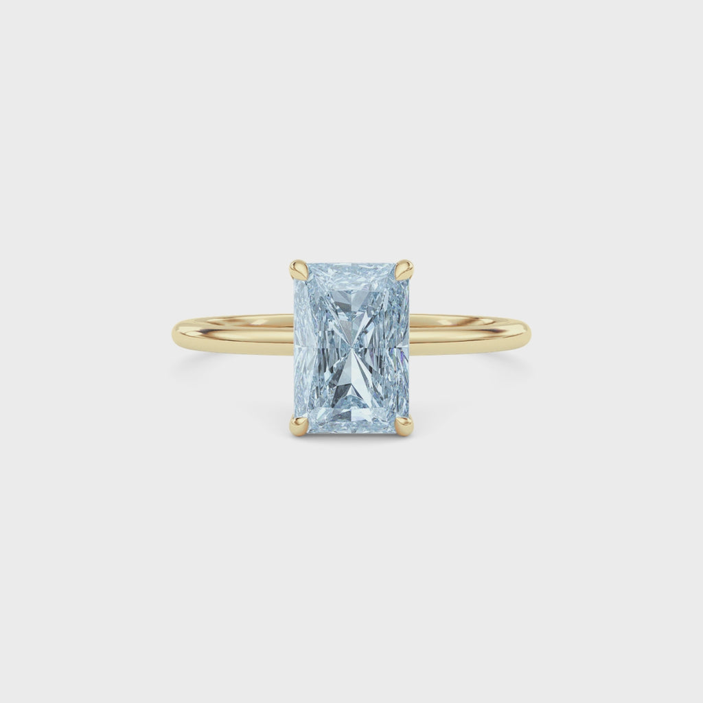 Yellow gold Fancy Blue Radiant Cut Diamond Hidden Halo Solitaire Engagement Ring with Prong Setting
