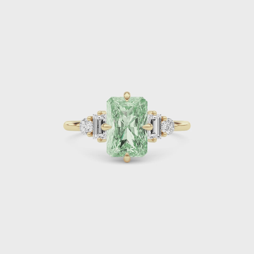 Yellow gold Fancy Green Radiant Cut Three Stone Diamond Engagement Ring with Tapered Baguette and Round Side Stones