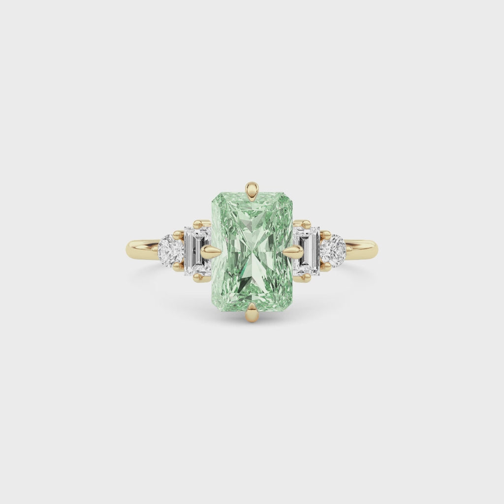 Yellow gold Fancy Green Radiant Cut Three Stone Diamond Engagement Ring with Tapered Baguette and Round Side Stones
