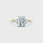 Yellow gold Three-Stone Fancy Blue Radiant Cut Diamond Ring with Trillion Side Stones