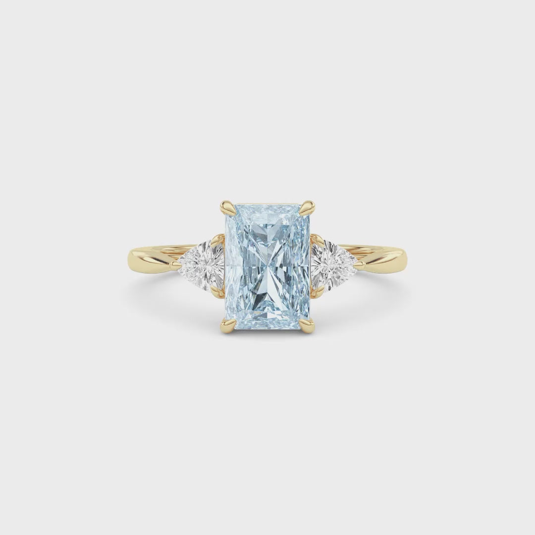 Yellow gold Three-Stone Fancy Blue Radiant Cut Diamond Ring with Trillion Side Stones