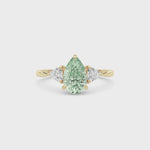 Yellow gold Three-Stone Fancy Green Pear Cut Diamond Ring with Trillion Side Stones
