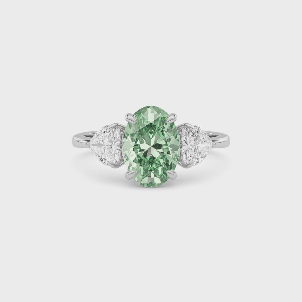 Silver Three-Stone Fancy Green Oval Cut Diamond Ring with Heart Side Stones