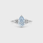 Platinum Fancy Blue Pear Cut Three Stone Diamond Engagement Ring with Tapered Baguette and Round Side Stones