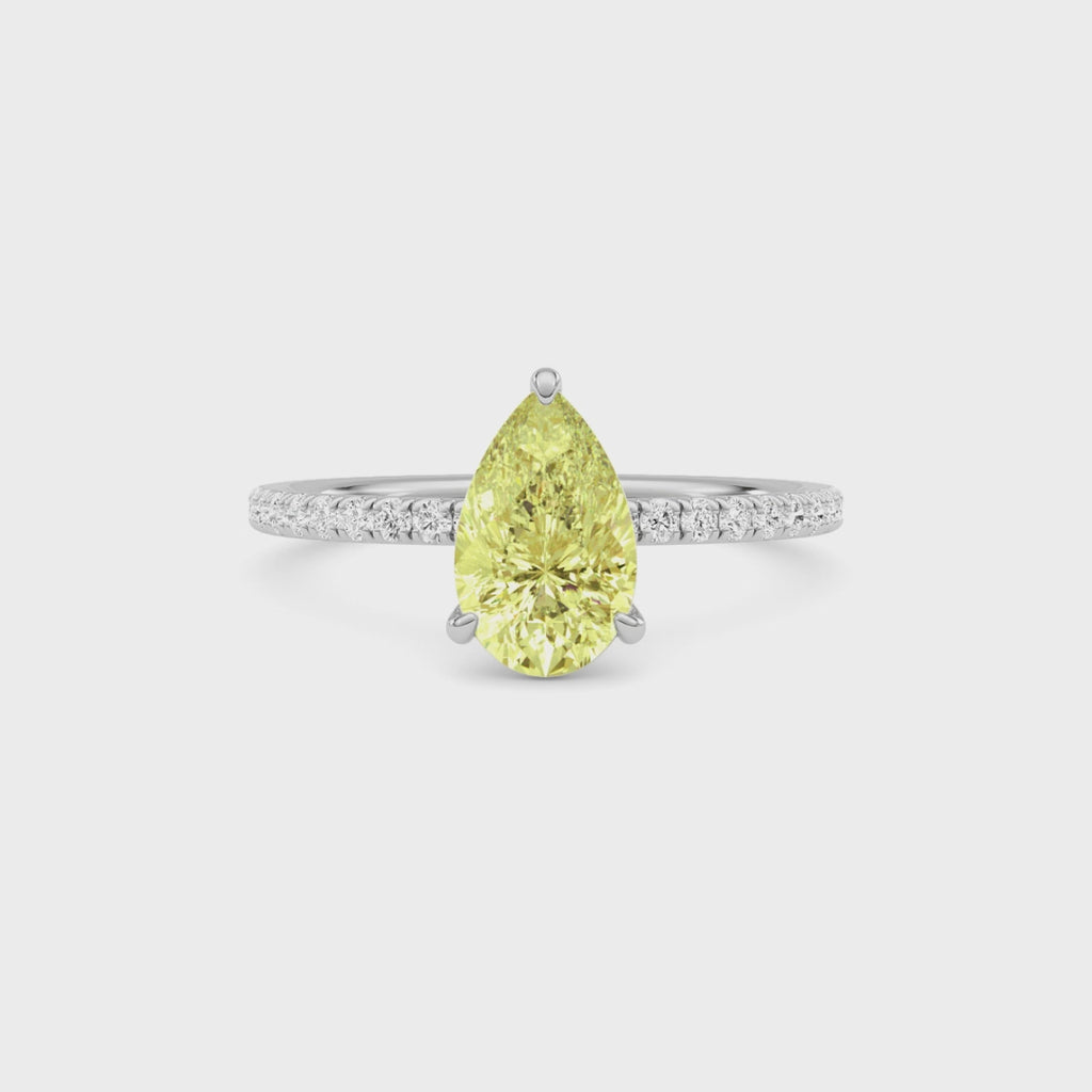 Yellow gold Fancy Yellow Pear Cut Diamond Solitaire with Pavé Band