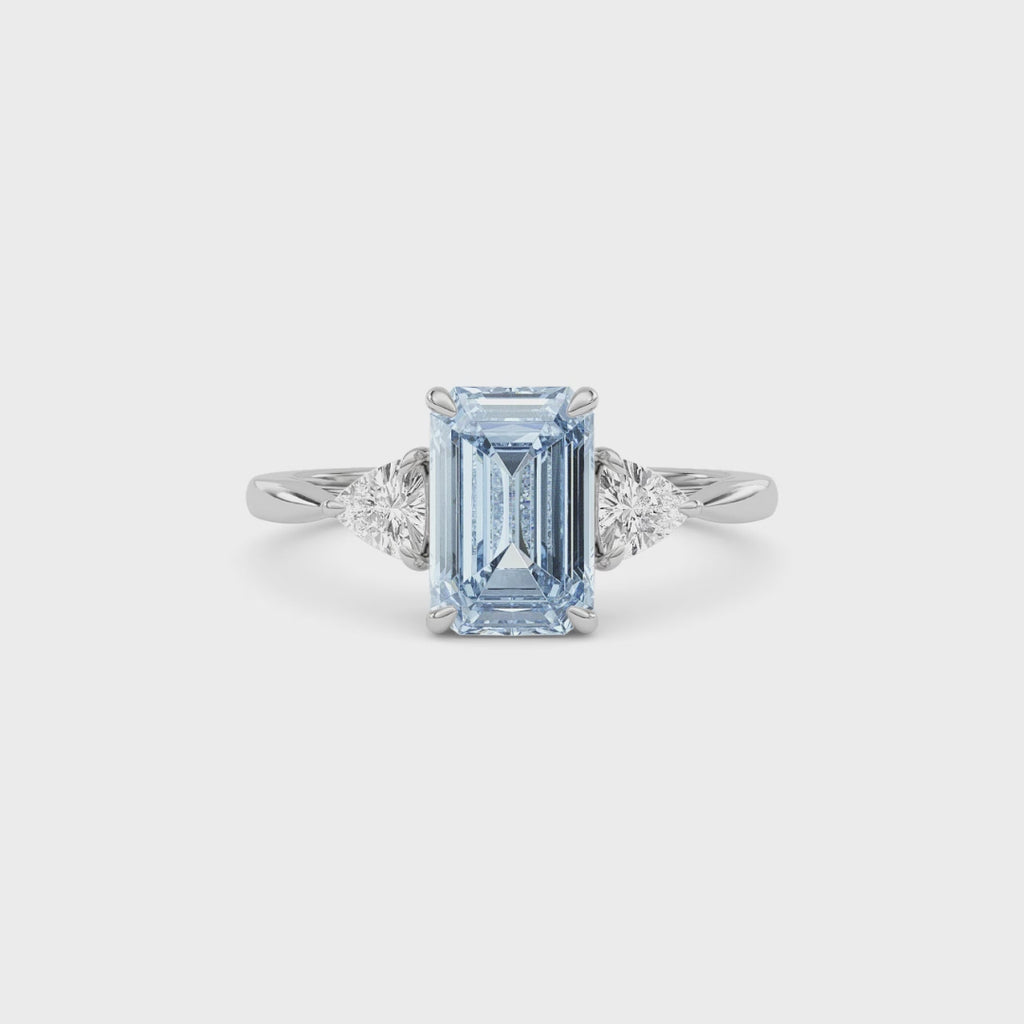 Silver Three-Stone Fancy Blue Emerald Cut Diamond Ring with Trillion Side Stones