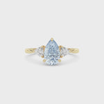 Yellow gold Three-Stone Fancy Blue Pear Cut Diamond Ring with Trillion Side Stones