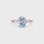 Rose gold Three-Stone Fancy Blue Oval Cut Diamond Ring with Tapered Baguette Side Stones