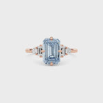 Rose gold Fancy Blue Emerald Cut Three Stone Diamond Engagement Ring with Tapered Baguette and Round Side Stones