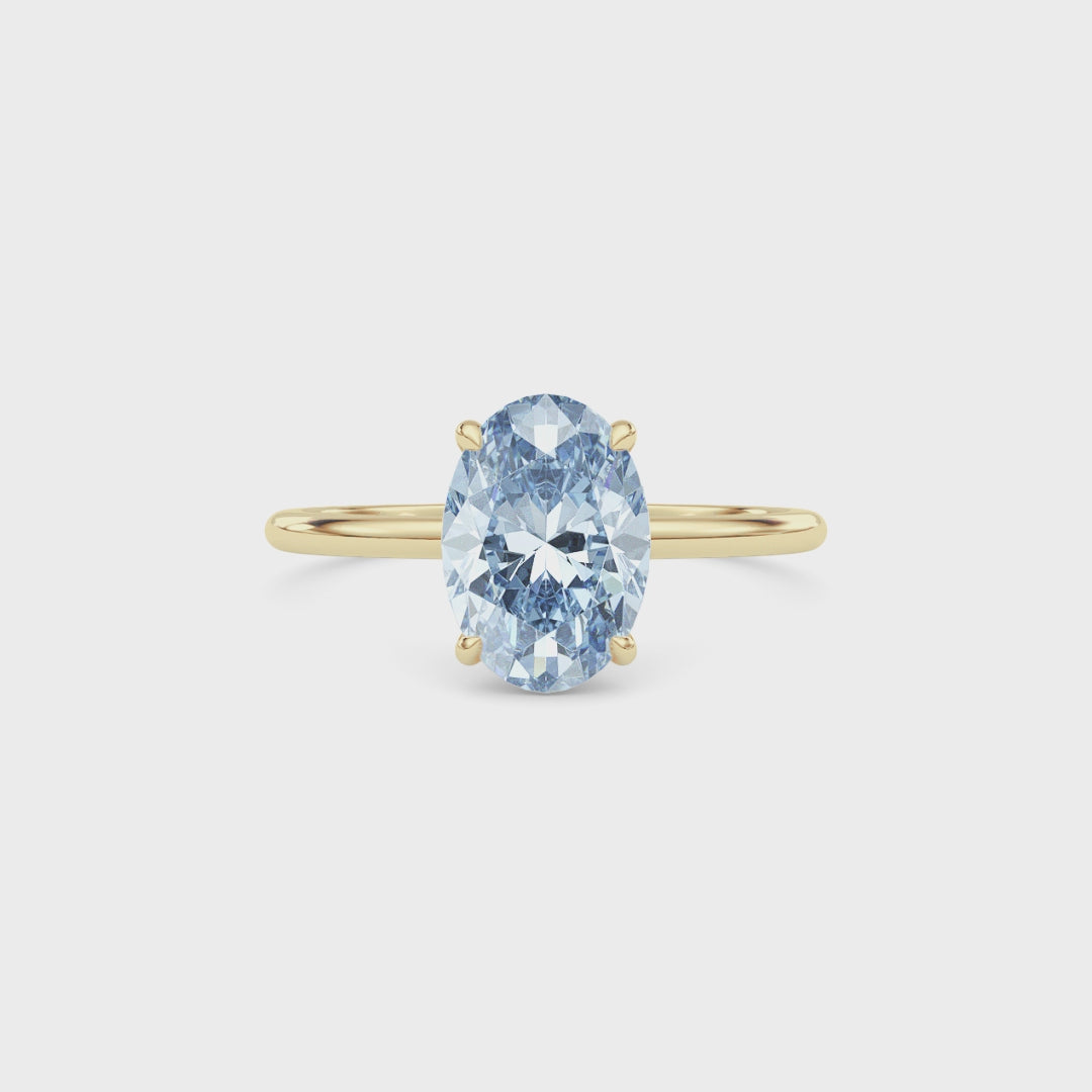 Yellow gold Fancy Blue Oval Cut Diamond Hidden Halo Solitaire Engagement Ring with Prong Setting
