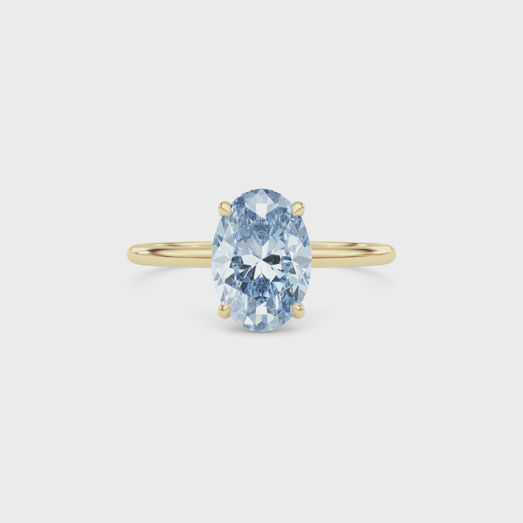 Yellow gold Fancy Blue Oval Cut Diamond Hidden Halo Solitaire Engagement Ring with Prong Setting