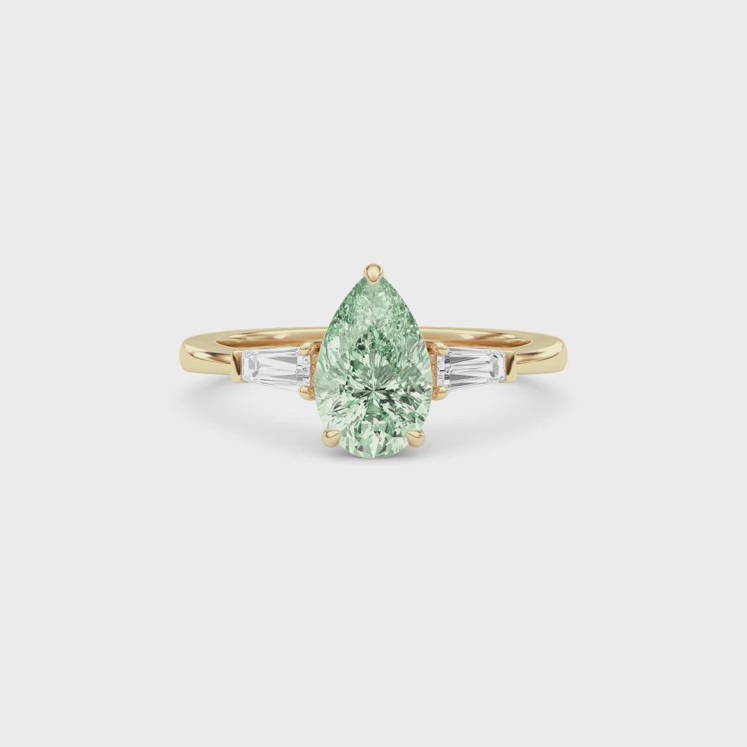 Yellow gold Three-Stone Fancy Green Pear Cut Diamond Ring with Tapered Baguette Side Stones