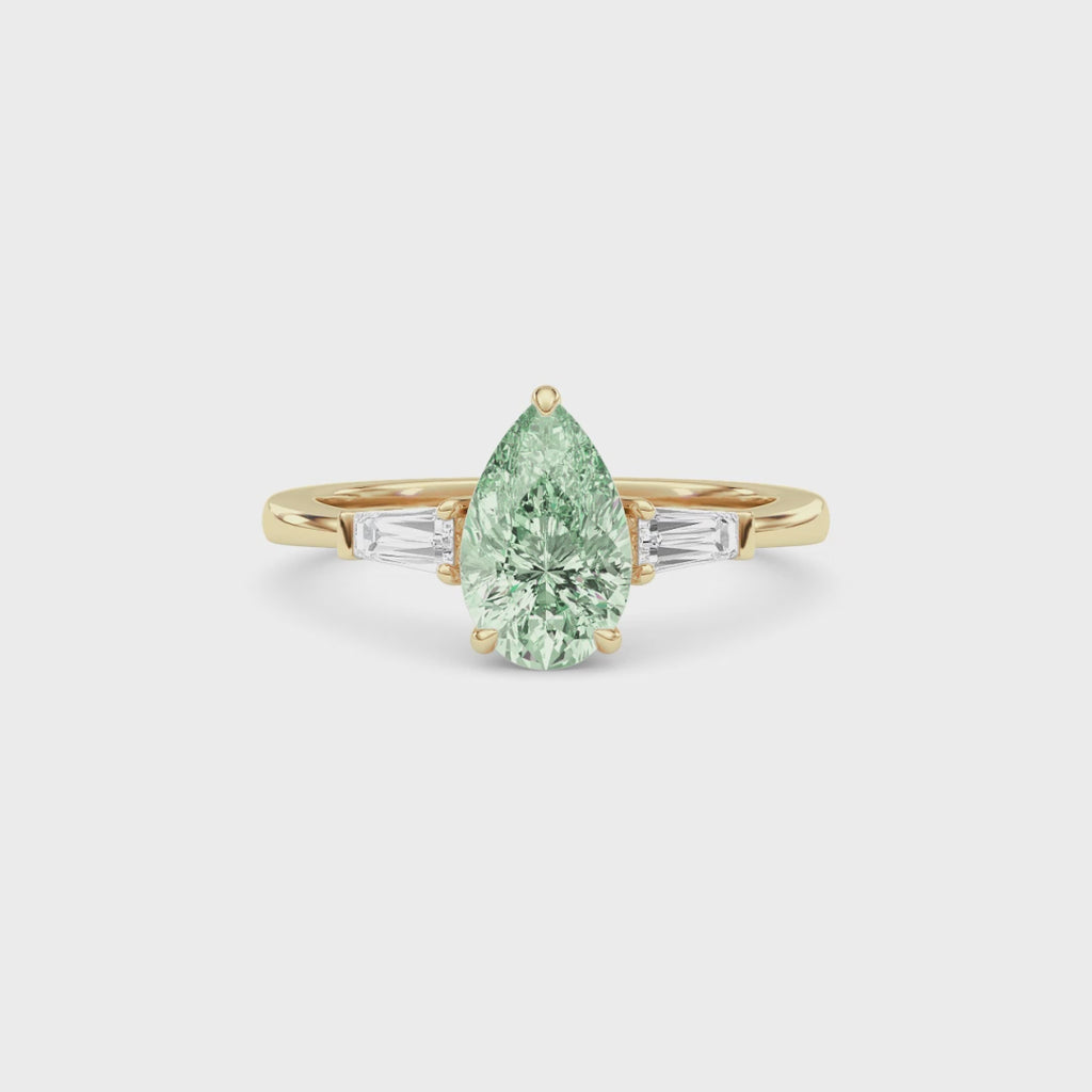Yellow gold Three-Stone Fancy Green Pear Cut Diamond Ring with Tapered Baguette Side Stones
