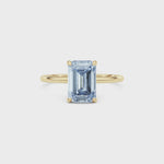 Yellow gold Fancy Blue Emerald Cut Diamond Hidden Halo Solitaire Engagement Ring with Prong Setting