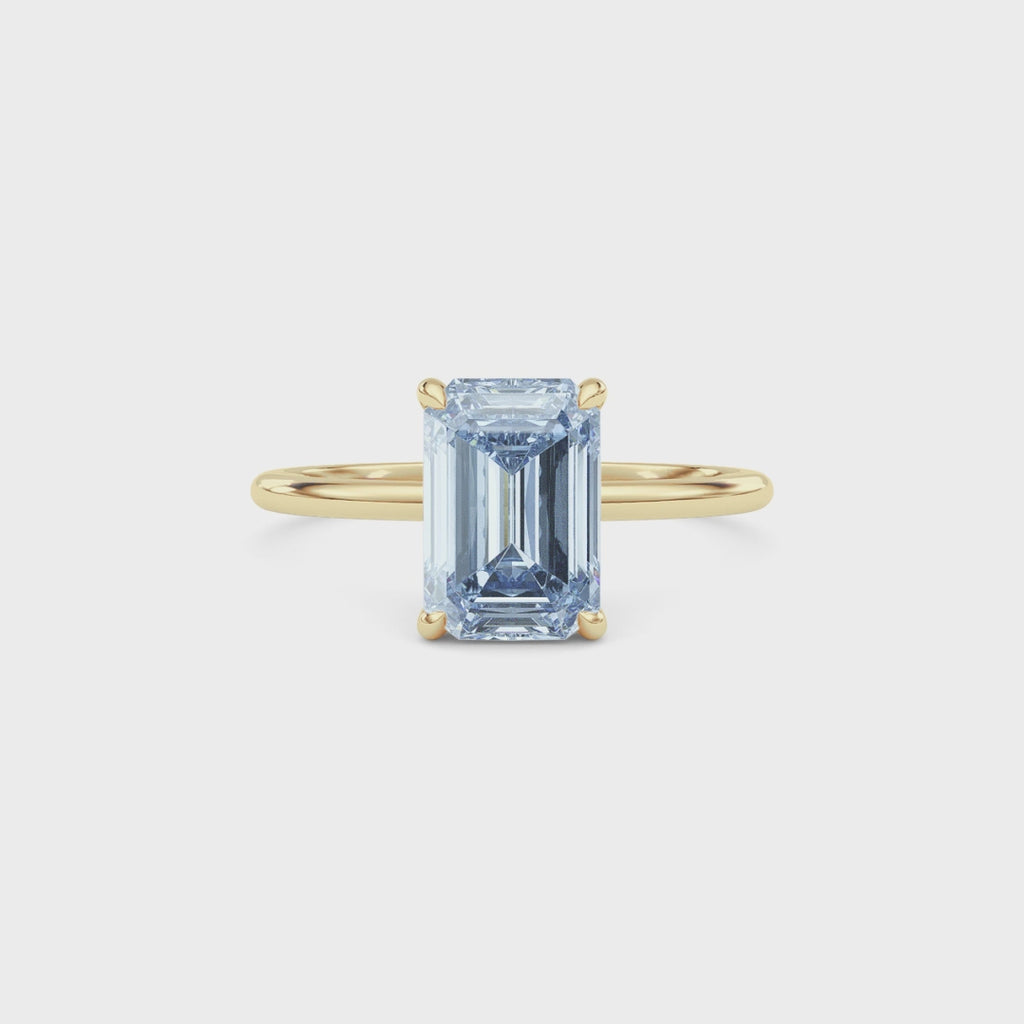 Yellow gold Fancy Blue Emerald Cut Diamond Hidden Halo Solitaire Engagement Ring with Prong Setting