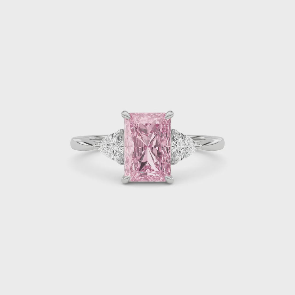White gold Three-Stone Fancy Pink Radiant Cut Diamond Ring with Trillion Side Stones
