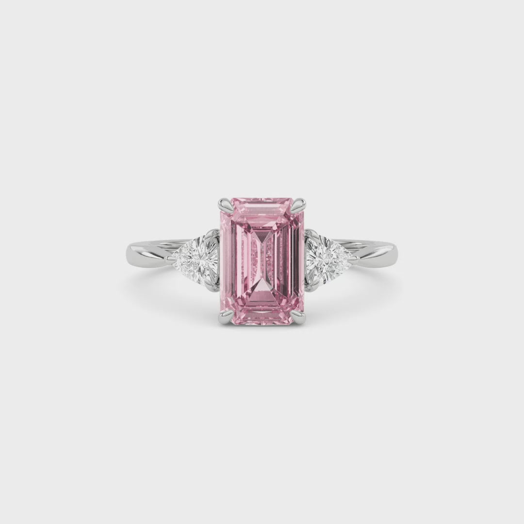 Platinum Three-Stone Fancy Pink Emerald Cut Diamond Ring with Trillion Side Stones