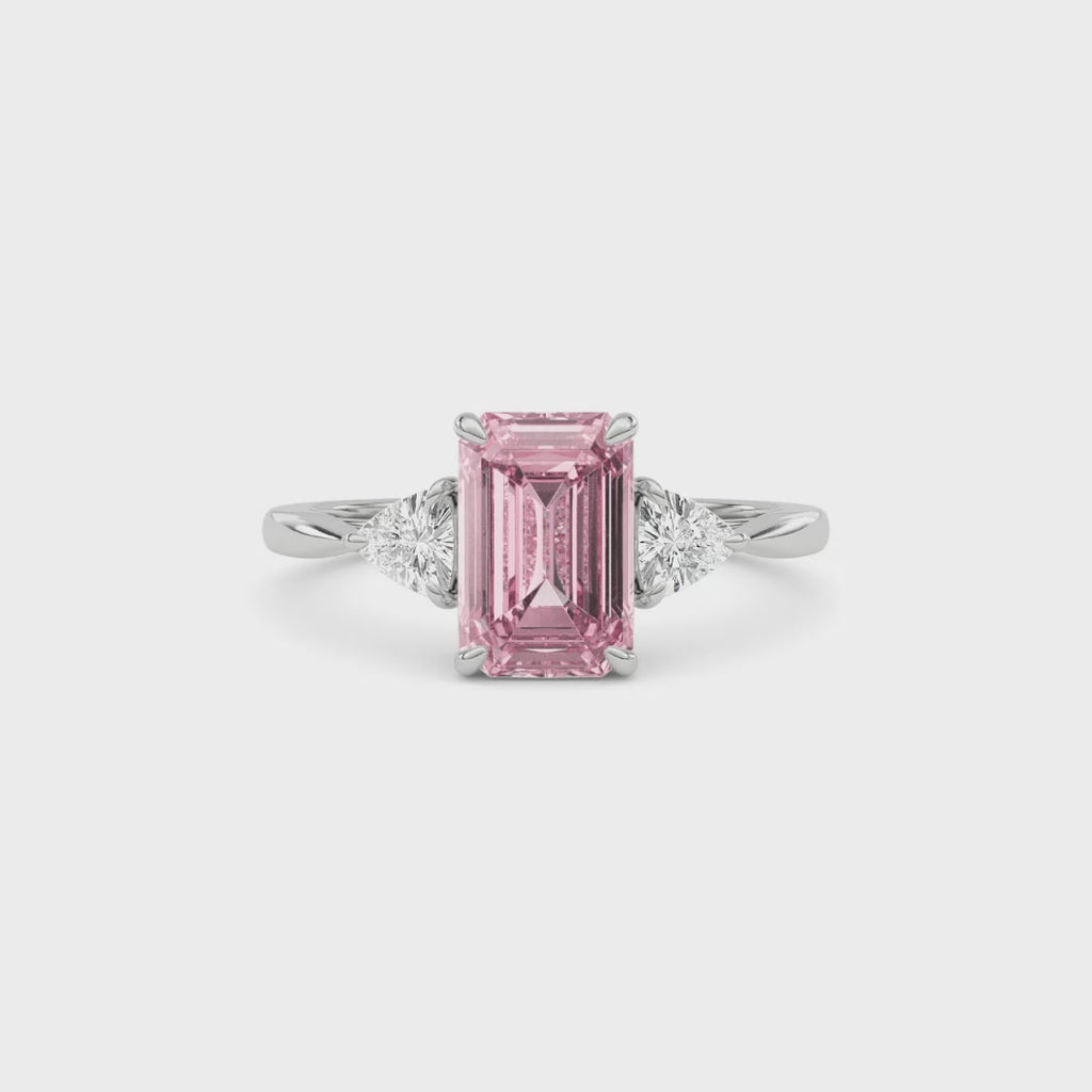 Platinum Three-Stone Fancy Pink Emerald Cut Diamond Ring with Trillion Side Stones