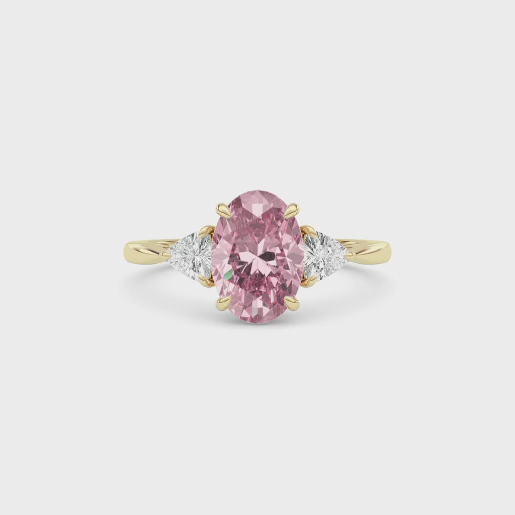 Yellow gold Three-Stone Fancy Pink Oval Cut Diamond Ring with Trillion Side Stones