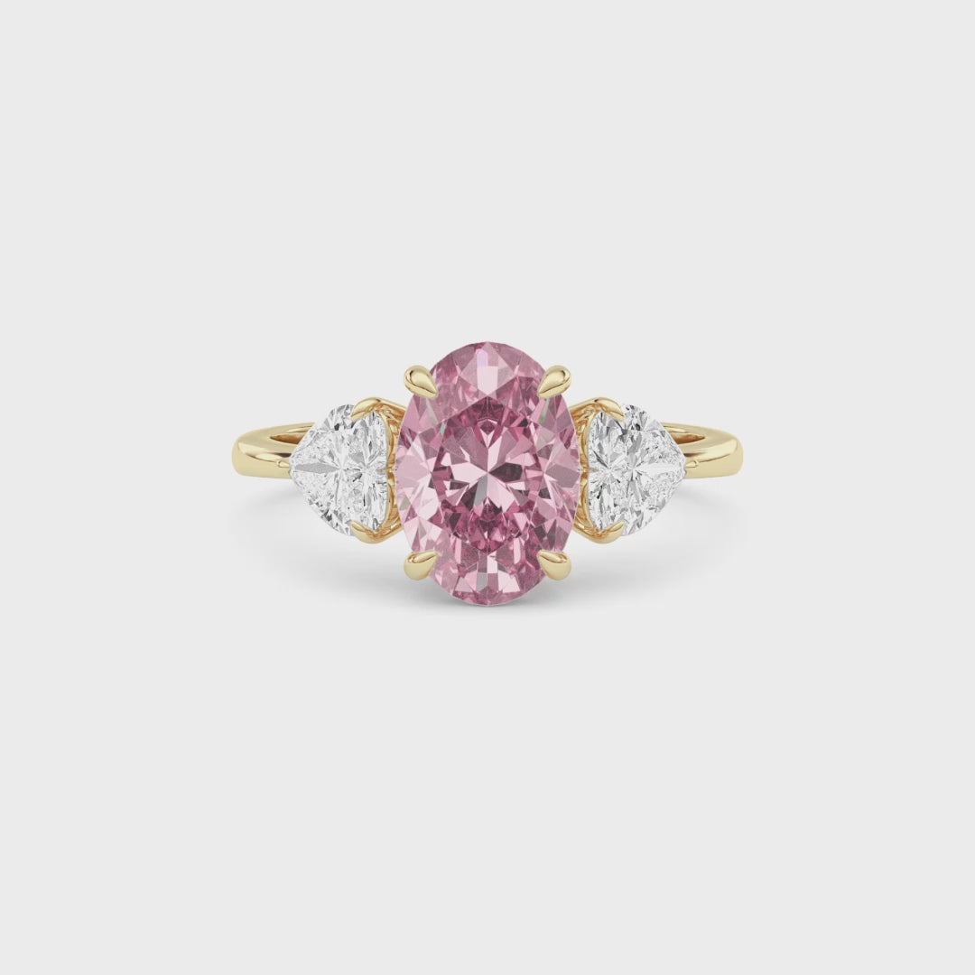 Yellow gold Three-Stone Fancy Pink Oval Cut Diamond Ring with Heart Side Stones