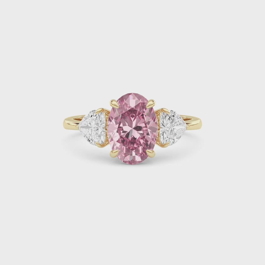 Yellow gold Three-Stone Fancy Pink Oval Cut Diamond Ring with Heart Side Stones