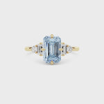 Yellow gold Three-Stone Fancy Blue Emerald Cut Diamond Ring with Heart Side Stones