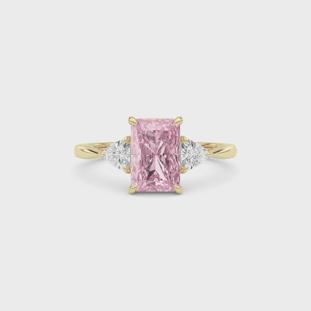 Yellow gold Three-Stone Fancy Pink Radiant Cut Diamond Ring with Trillion Side Stones