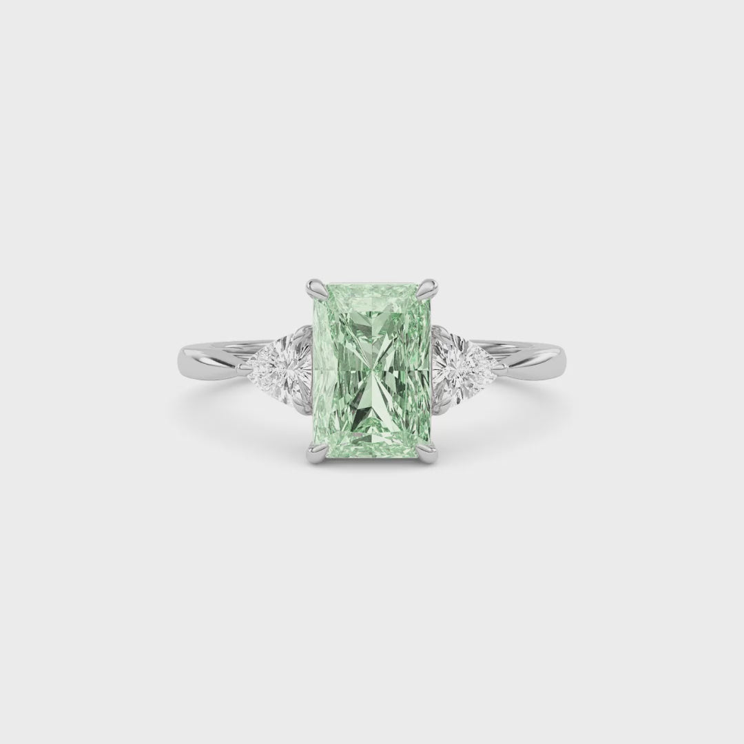 White gold Three-Stone Fancy Green Radiant Cut Diamond Ring with Trillion Side Stones
