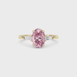 Yellow gold Three-Stone Fancy Pink Oval Cut Diamond Ring with Tapered Baguette Side Stones