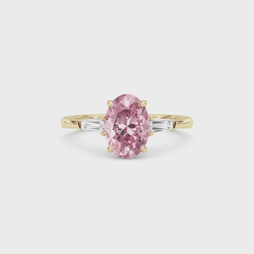Yellow gold Three-Stone Fancy Pink Oval Cut Diamond Ring with Tapered Baguette Side Stones