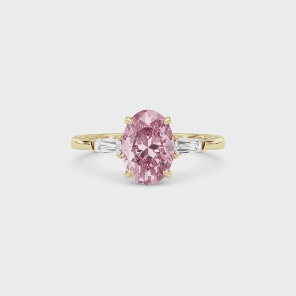 Yellow gold Three-Stone Fancy Pink Oval Cut Diamond Ring with Tapered Baguette Side Stones