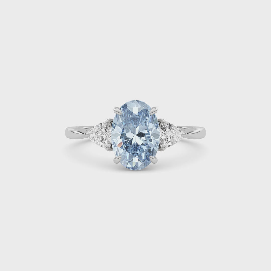 Silver Three-Stone Fancy Blue Oval Cut Diamond Ring with Trillion Side Stones