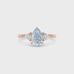 Rose gold Three-Stone Fancy Blue Pear Cut Diamond Ring with Trillion Side Stones