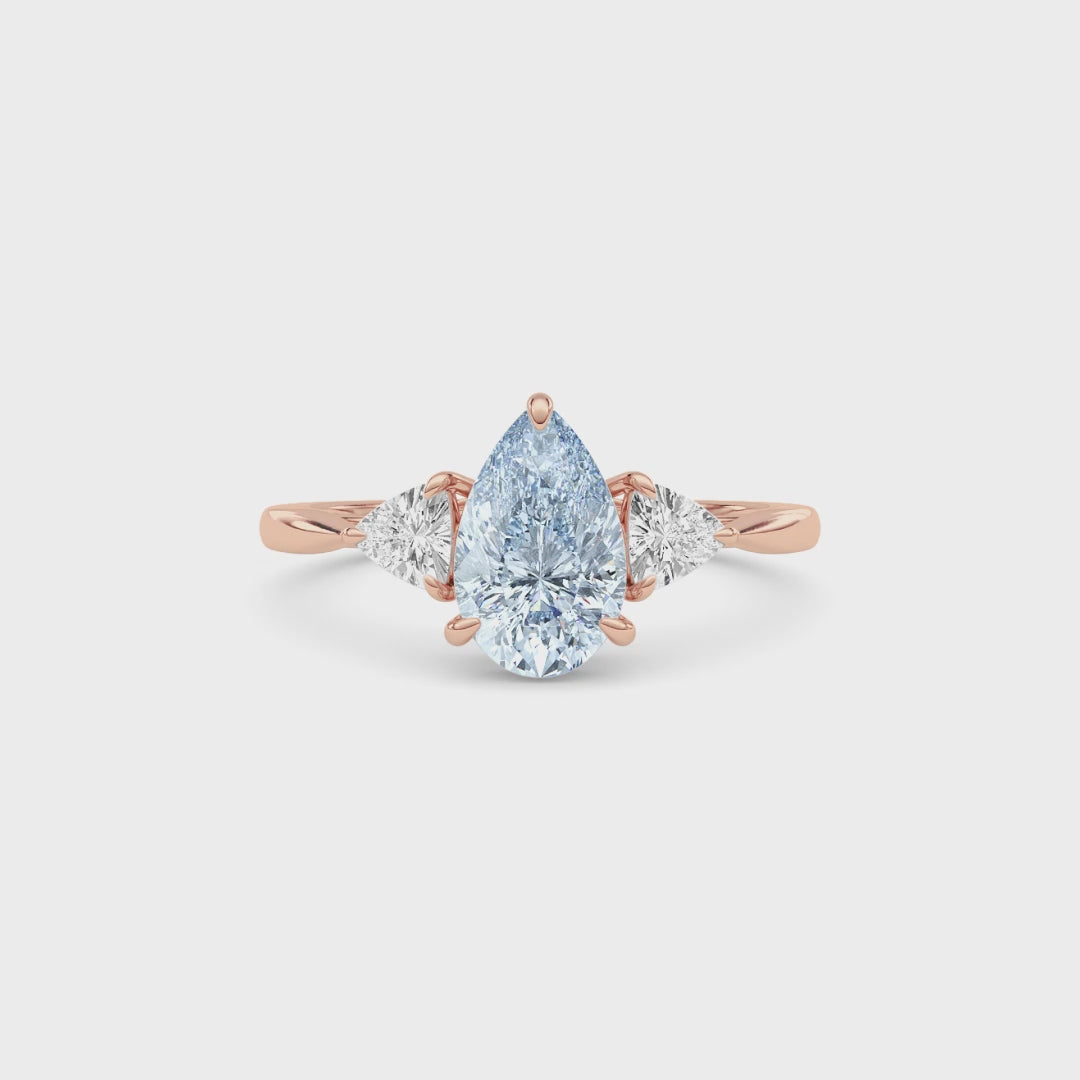 Rose gold Three-Stone Fancy Blue Pear Cut Diamond Ring with Trillion Side Stones