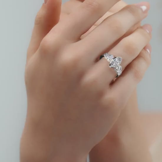 Silver Marquise Diamond Ring with Bezel Setting and Round Side Accents