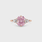 Rose gold Fancy Pink Cushion Cut Three Stone Diamond Engagement Ring with Tapered Baguette and Round Side Stones