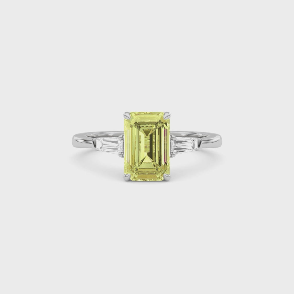 Yellow gold Three-Stone Fancy Yellow Emerald Cut Diamond Ring with Tapered Baguette Side Stones