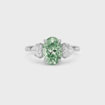 Platinum Three-Stone Fancy Green Oval Cut Diamond Ring with Heart Side Stones